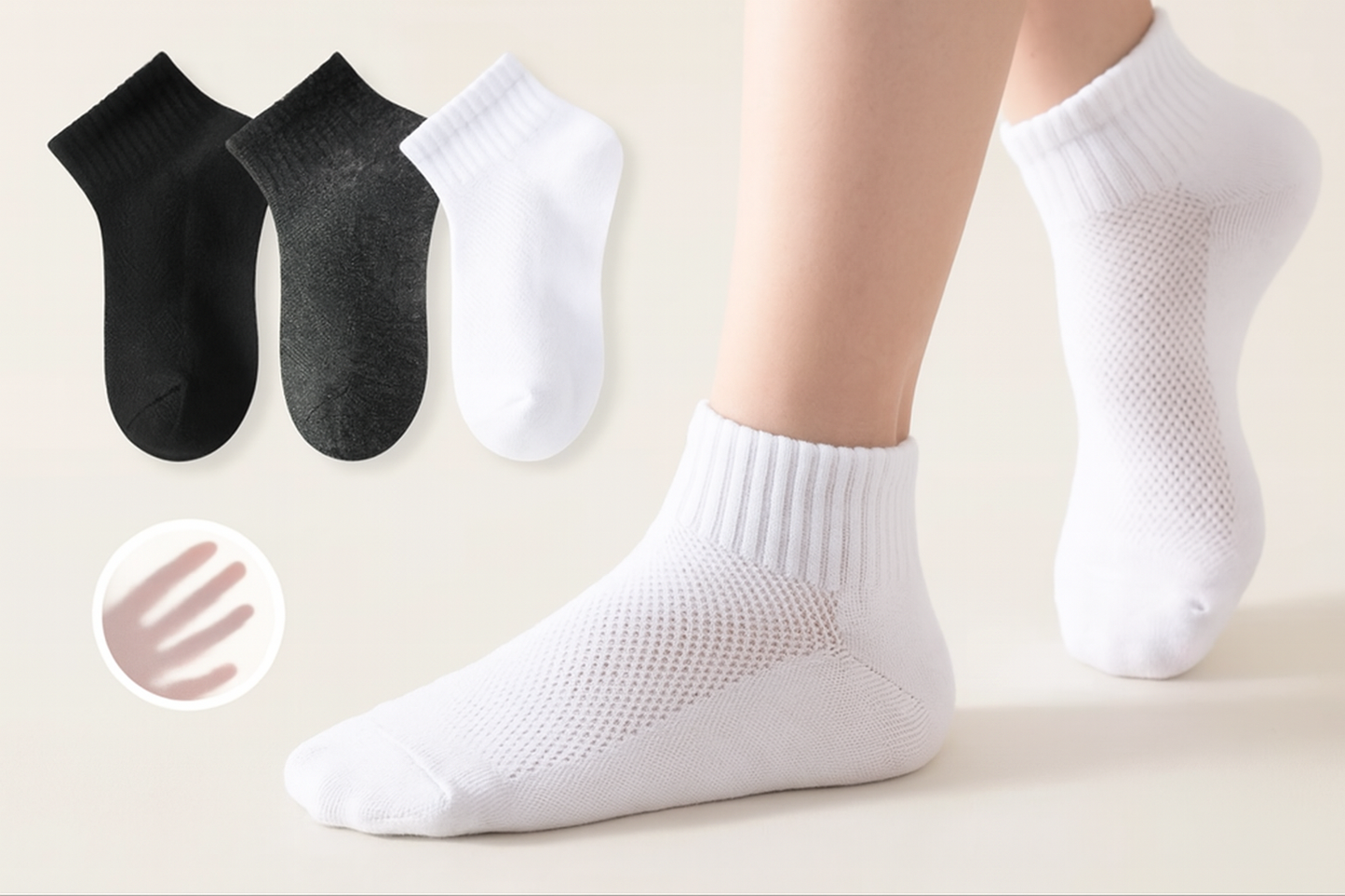 White ankle socks with black and gray socks in the background on a light beige surface.