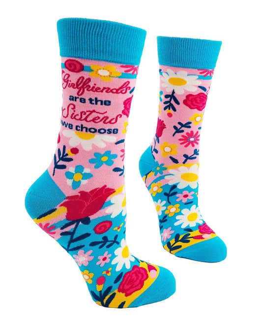 Colorful socks with floral patterns and text on a white background